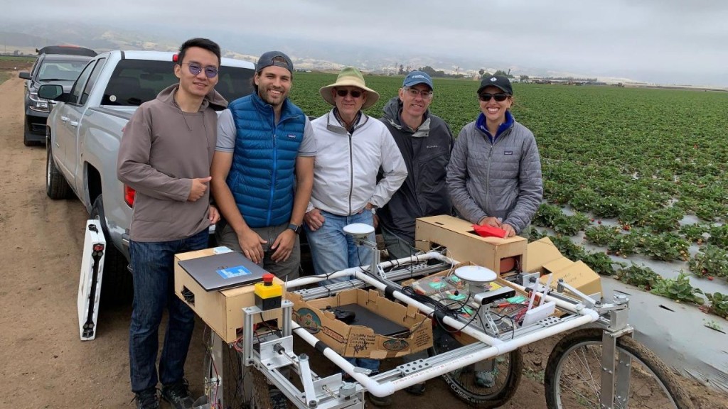 Bio-Automation Lab team with field robot in a strawberry field